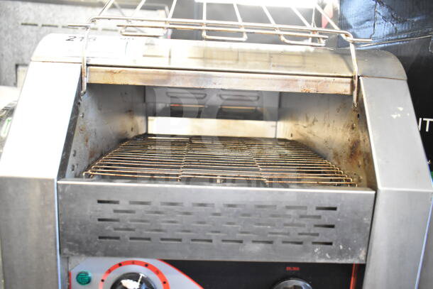 Commercial electric conveyor toaster oven, model BI006192, 110 volts, 1 phase. Showing signs of use; equipped with control dials.