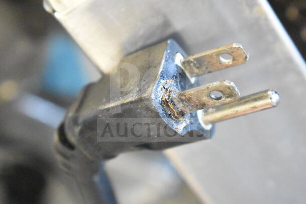 Damaged power plug of BI006192 Commercial Electric Conveyor Toaster Oven, model BI006192, showing rust and wear.