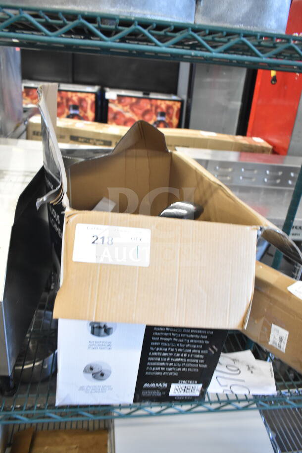 Brand new AvaMix Revolution 928CFEED continuous feed attachment in opened box, minor scratches, visible labeling.