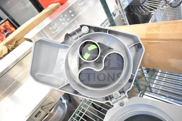 Brand new AvaMix Revolution 928CFEED Continuous Feed Attachment, visible minor scratches, gray plastic housing.