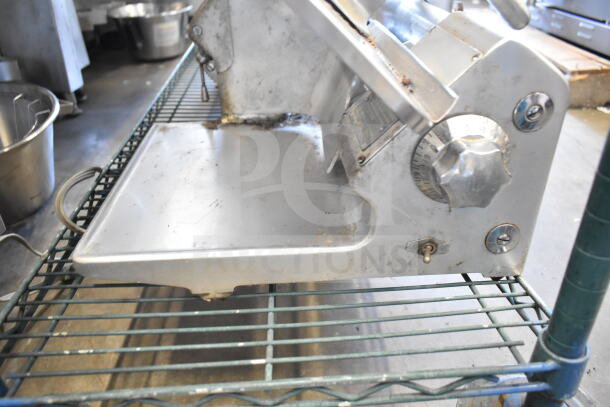 Toledo 5401 commercial meat slicer with blade sharpener, 110V, 1-phase. Visible wear, controls labeled for precision slicing.