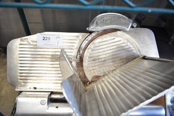 Toledo 5401 Commercial Meat Slicer with blade sharpener, stainless steel, 110V, used condition. Visible auction tag.