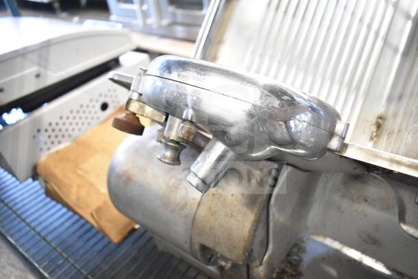 Toledo 5401 commercial meat slicer with blade sharpener, used condition, visible wear, 110 volts, 1 phase.