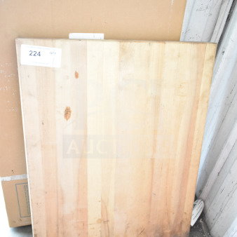 Butcher block wooden cutting board, rectangular, light wood with visible grain, minor wear, tag number 224 displayed.