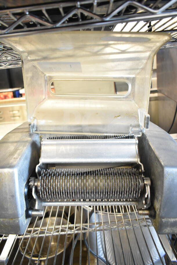 Berkel 705 electric meat tenderizer; commercial countertop model, 115 volts, 1 phase, visible metal rollers in good condition.