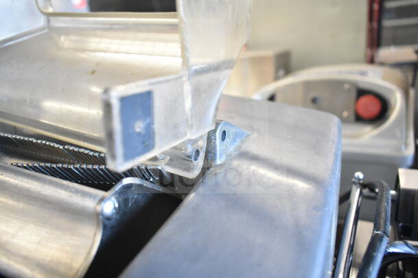 Berkel 705 commercial meat tenderizer, electric-powered, 115V, 1 phase. Close-up of metal blades and durable build.