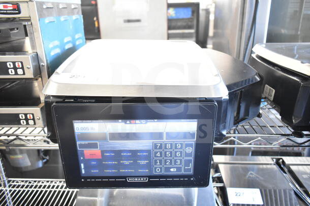 2017 Hobart HTi-7LH26 commercial food portioning scale, touchscreen interface, no power cord, tested working, visible label.