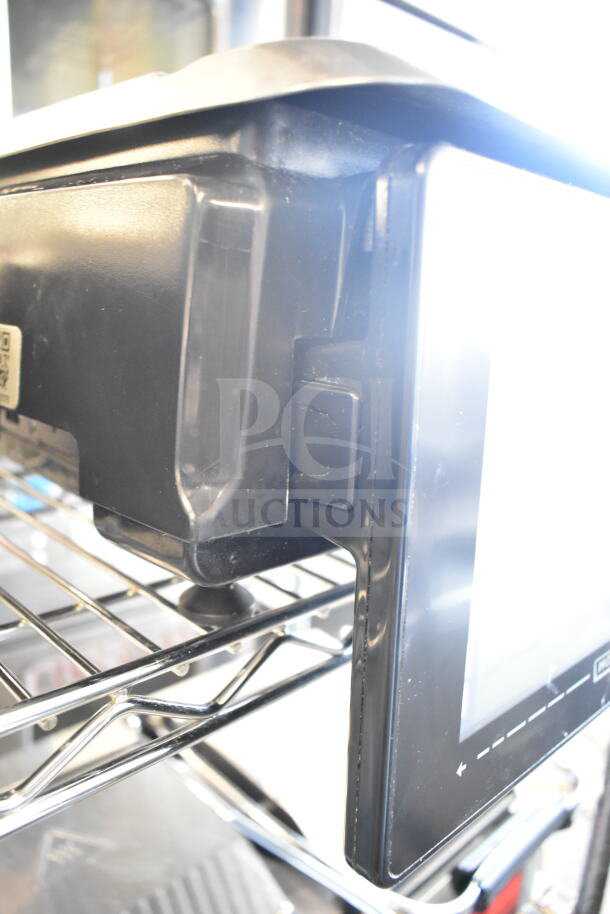 2020 Hobart HTi-7LH4W commercial food scale, tested and working, black frame, positioned on metal shelf.
