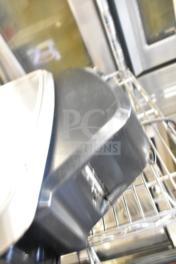 2020 Hobart HTi-7LH4W commercial food portioning scale, black, in tested working condition, shown on a metal rack.