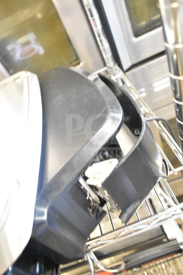 2020 Hobart HTi-7LH4W commercial countertop food portioning scale, black, tested and working, shown on metal rack.
