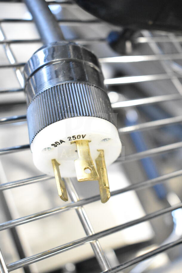 Clover Countertop Single Group Espresso Machine plug, 30A 250V, close-up view showing prongs and markings.