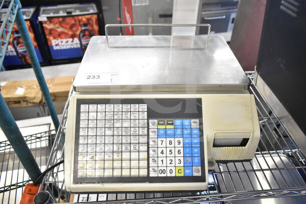 CAS CL5000-R commercial scale, 60 lb capacity, keypad interface, stainless steel platform, 120V, used condition, label visible.
