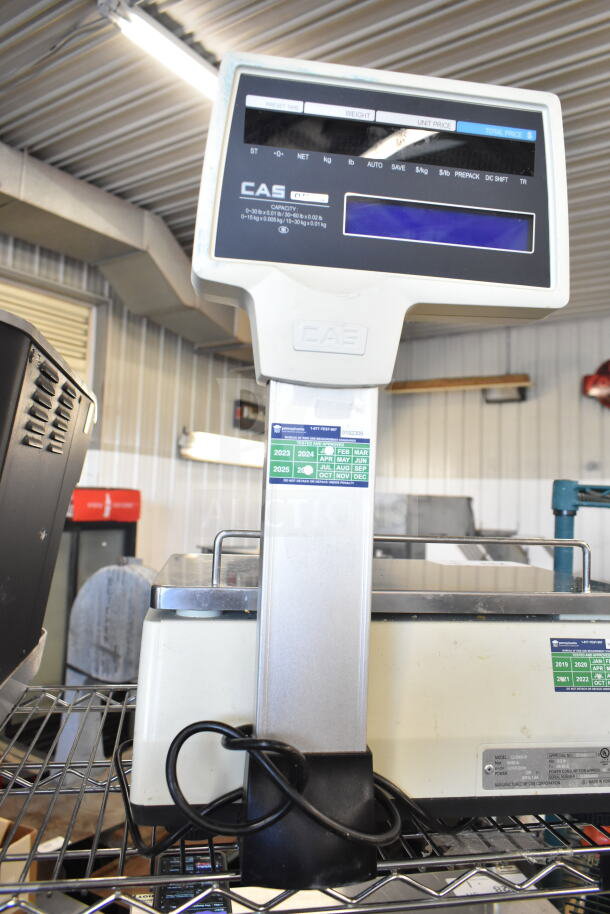 CAS CL5000-R commercial countertop scale, 60 lb capacity, 120V, 1 phase; features display panel and recent inspection stickers.