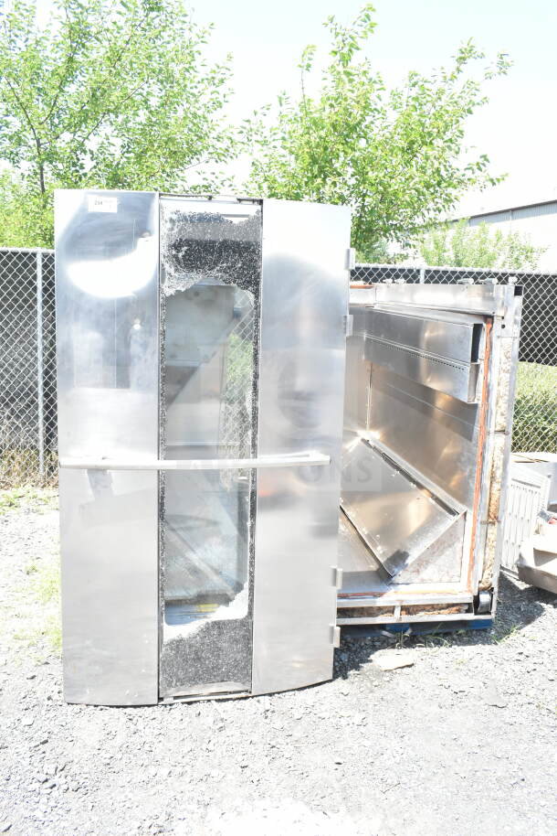 Hobart Commercial Roll In Rack Oven, stainless steel, damaged glass, outdoor setting, visible wear, industrial use.