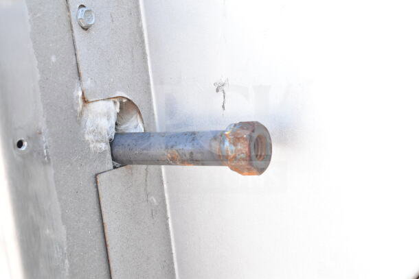Close-up of a component on a Hobart Commercial Roll In Rack Oven, showing a metal rod with rust.