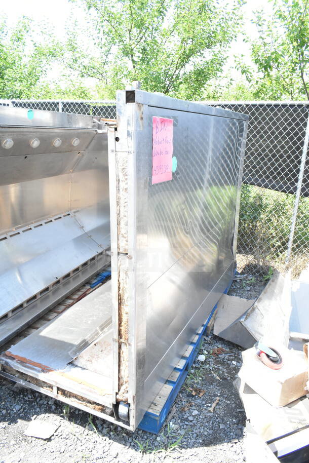 Hobart Commercial Roll In Rack Oven, stainless steel, visible wear, outdoor setting, pink label with handwritten details.