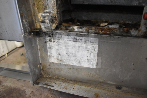 Therma-tek TMDR-6-1N commercial gas range, 6 burners, oven, visible wear and grime; serial plate shows model and NAT marking.