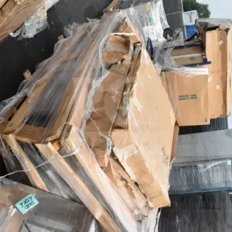 4 new scratch and dent items, including shelving posts and work table undershelf, wrapped on pallets. Labels show "SKID 3 OF 2."