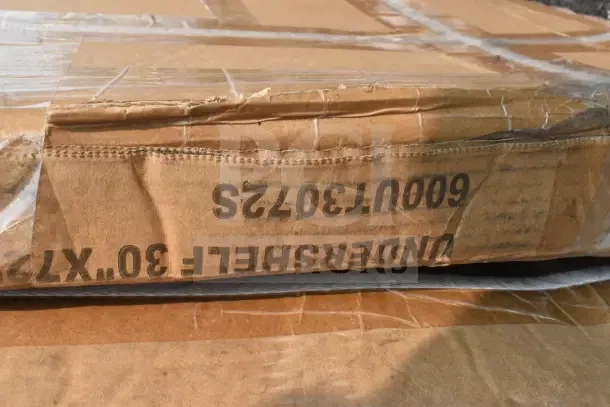 Cardboard box containing scratch and dent items, marked "UNDERSHELF 30"X72" 600UT30-72S".