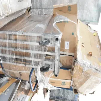Pallet with wrapped boxes marked "243" containing brand new scratch and dent items, including sink bowls and faucets.
