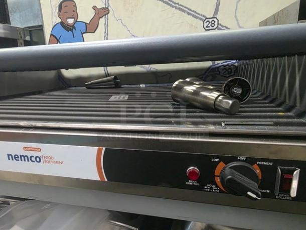 Nemco 8075SX 75 Hot Dog Roller Grill, 208V, 60Hz. Stainless steel, front control panel visible, in good condition.