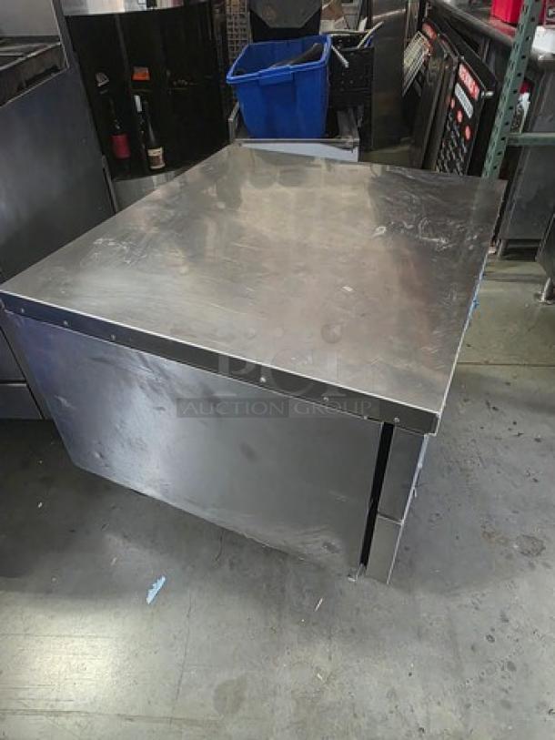 Atosa MGF8448GR 36″ refrigerated chef base. Stainless steel with visible wear. Industrial kitchen equipment.