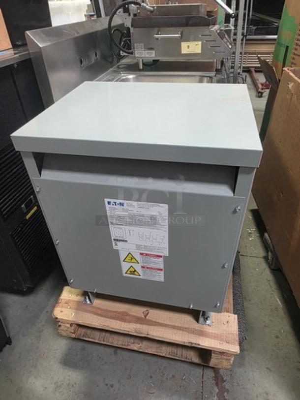 Eaton V48M28T1516 ventilated transformer, three-phase, 15 kVA, 480V primary, 208Y/120V secondary, labels visible.