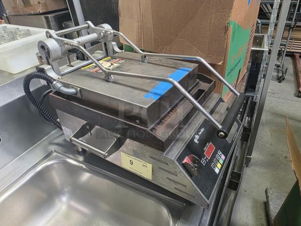 Star CG14IE single commercial panini press with cast iron grooved plates, used condition, visible control panel.