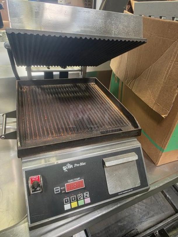 Star CG14IE Single Commercial Panini Press with cast iron grooved plates, used condition, visible control panel.