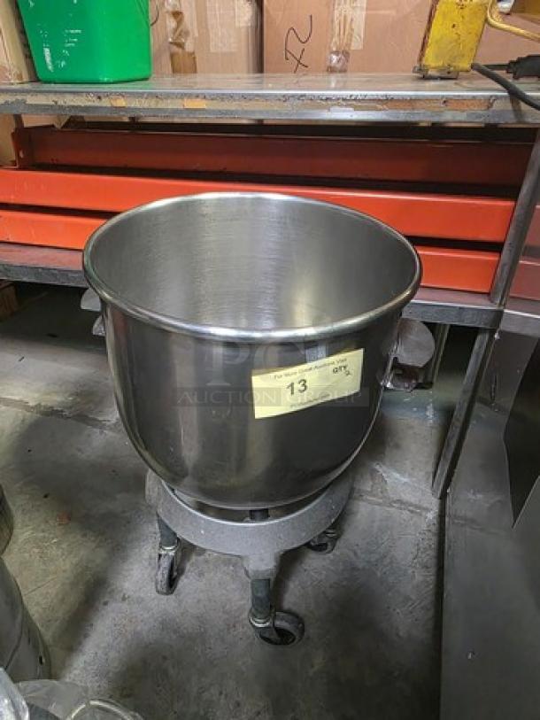 Stainless steel mixing bowl on rolling cart, with yellow tag labeled "13", in good condition.