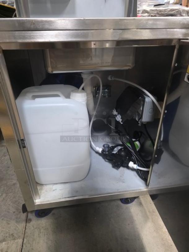 Regency Space Saver hand sink cart, model 600PHS24HC, featuring a single bowl, hot and cold water, portable design, and storage container.