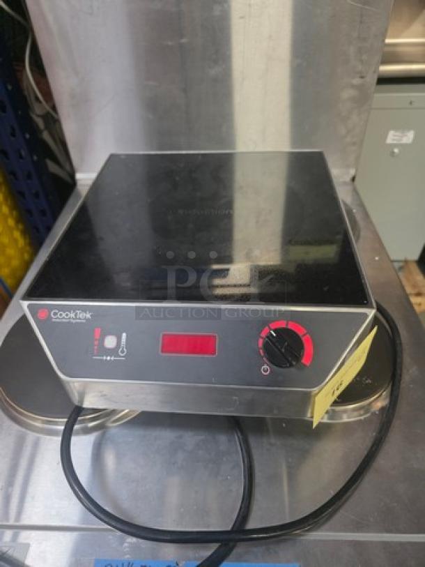 CookTek MC1500 single burner induction cooktop, 1500W. Error code 02 displayed. Slight wear. Countertop model.