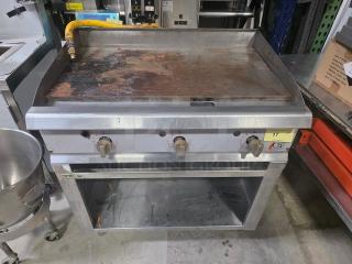 CPG 36" gas countertop griddle with Regency stainless steel open base stand, used condition, visible rust on griddle surface.