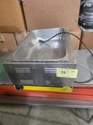 Qualite full-size electric countertop food warmer, stainless steel, visible power cord, dial control, in used condition.