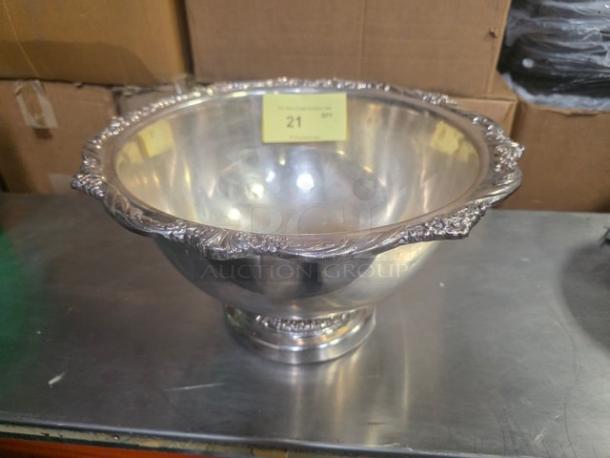 Stainless steel punch bowl with ornate rim detailing, in good condition. Features item tag indicating quantity "21".