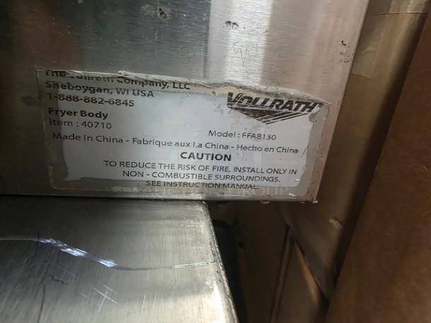Vollrath Countertop Fryer, Model FFA8130, 220V, 60Hz, 1 PH, stainless steel, worn label, caution for installation.