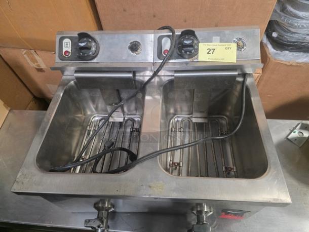 Vollrath countertop fryer model FFA8130, 220V, 60Hz, 1 PH. Dual compartments, stainless steel, visible wear. Includes power cords.