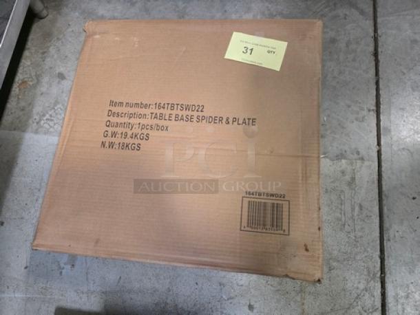 Brown cardboard box labeled "Table Base Spider & Plate." Item number: 164TBTSWD22. Quantity: 1 piece. Gross weight: 19.4 KGS. Net weight: 18 KGS.
