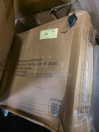 Cardboard box labeled "Table Base Spider & Plate," item number 164TBSPW02, 1 pc/box, weight 19.4kg gross, 18kg net.