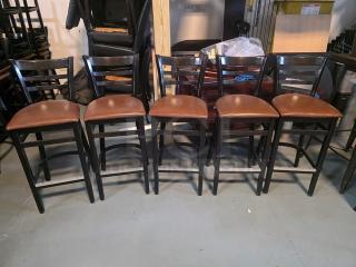 Lot of 5 wooden bar stools with brown cushioned seats, ladder-back design, in good condition.