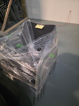 Lot of 5 stacking chairs with black fabric seating and gray powder-coated frames, wrapped in plastic.