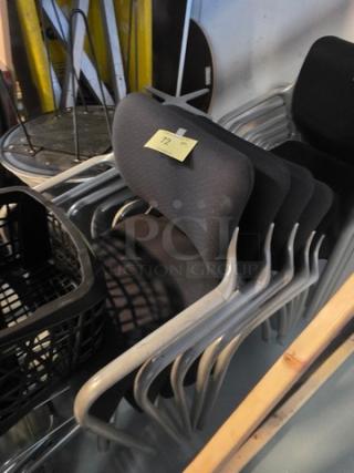 Lot of 5 stacking chairs with black fabric seats, gray powder-coated frames. Good condition, versatile for various settings.