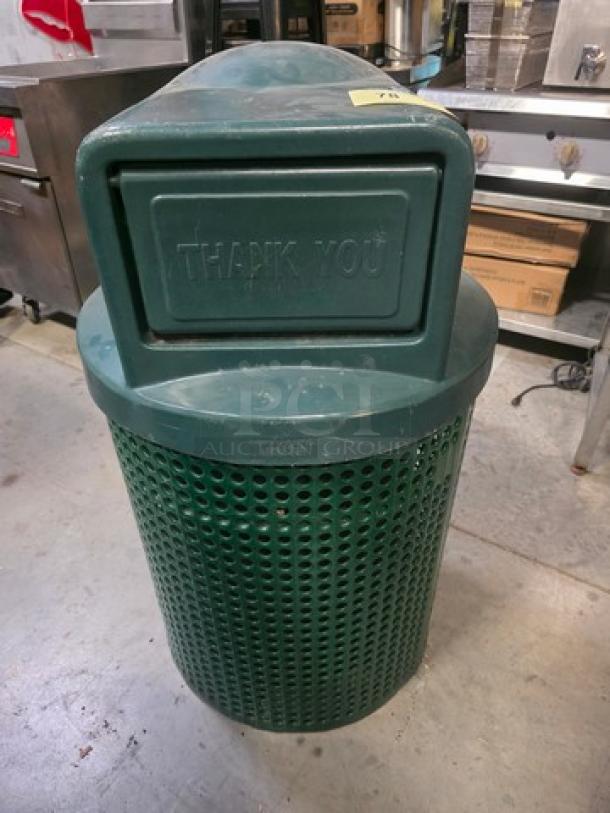 Green outdoor trash receptacle with perforated design, featuring a top flap labeled "Thank You." Used but good condition.
