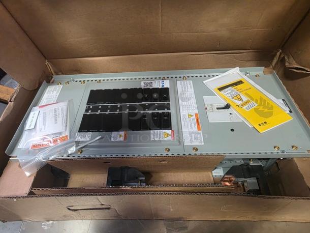Eaton Pow-R-Line Xpert 1X Panelboard, PRL1X model, in new condition with safety labels and packaging, showing circuit breakers.
