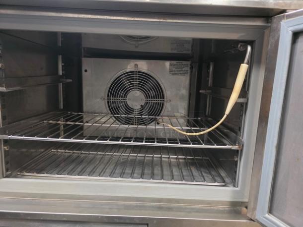 Blast Chiller Model BCF44244-0AX6 with blown fuse, untested, sold as is. Interior view with racks and a fan.