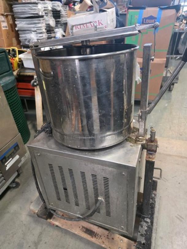 Lakshmi Tilting Commercial Wet Grinder, stainless steel, used condition, visible wear, tilting mechanism, industrial setting.