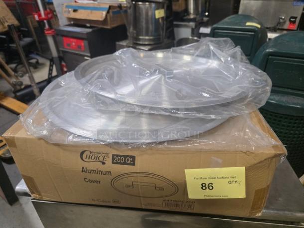 Lot of 6 aluminum pot covers by Choice, 200 Qt. capacity, new condition in original packaging. Box labeled "6/Case PEO."