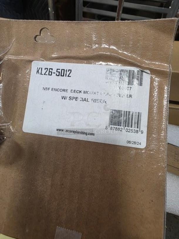 Encore KL26-5012 deck-mounted glass filler packaging, label showing model number and barcode, new condition.