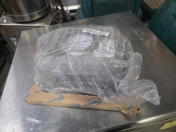Proflo PFSR151562A self-rimming stainless steel single bowl bar sink, wrapped in plastic, new condition, with packaging.