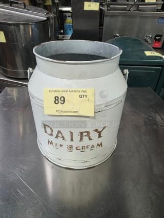 Galvanized dairy bucket with "Dairy Milk & Cream" marking, vintage condition, handle on each side, auction lot 89.
